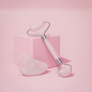 Pink calcite face roller and Gua Sha set